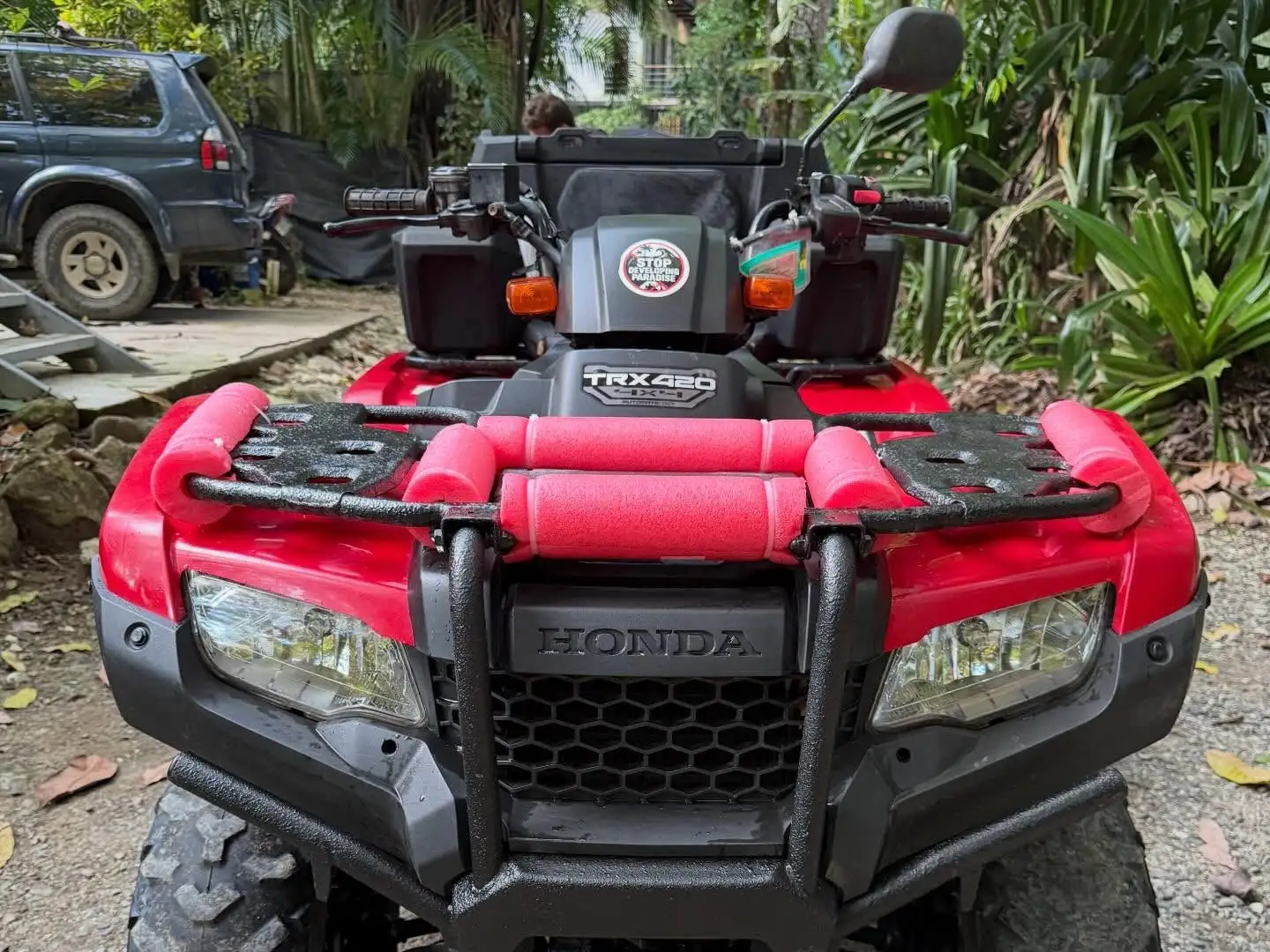 Front of the red Honda TRX420 ATV